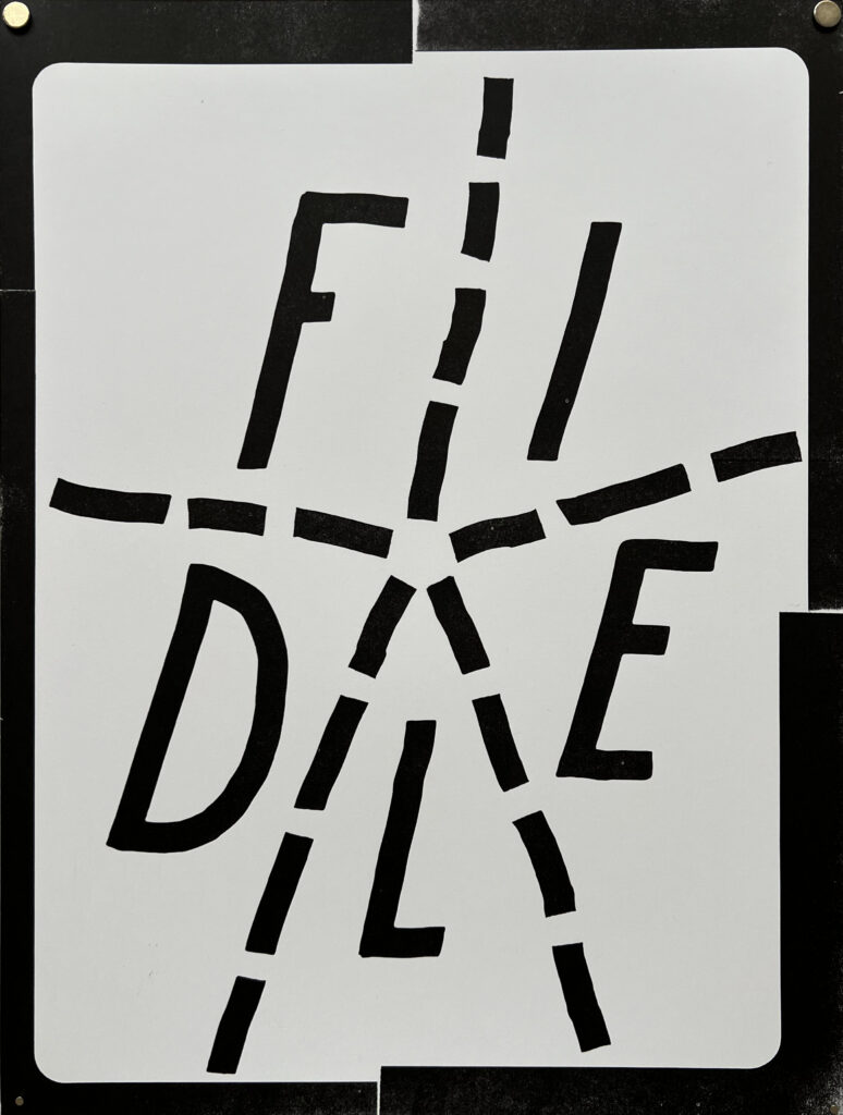 The letters F I E L D arranged in a spiral and divided by a dashed line in a star shape that creates five sections. The letters and line dashes are black. The background is gray with a black border that is heavier in different spots. There are two magnets holding up the print.